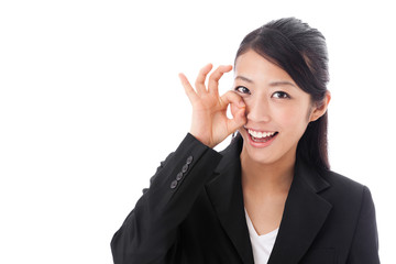 asian businesswoman showing okay sign on white background