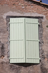 Window with wooden shutters