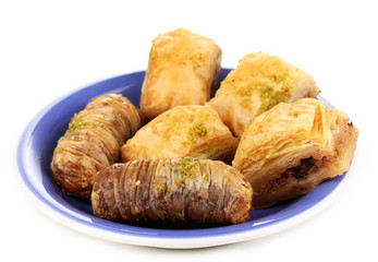 Sweet baklava on plate isolated on white