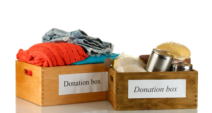 Donation Boxes With Clothing And Food Isolated On White