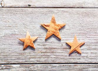 Christmas stars on grungy wood