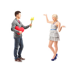 Man holding a flowers and an excited female