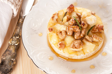 Baked cheese Camembert  with honey, nuts and toast