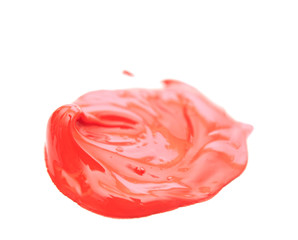 close up of red paint drops on white background