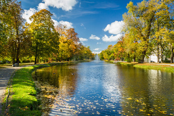 Fototapeta premium Path by the river in the park autumn season