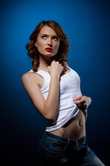 Naklejka premium Sexy Young woman in jeans white tank top
