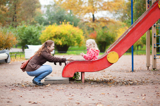 Mother And Daughter Having Fun Together On Playground