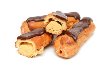сhocolate eclairs isolated on white
