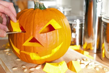 Foto op Plexiglas Halloween Jack O'Lantern being carved for Halloween © Skowron