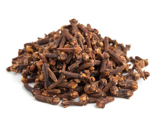 Heap of whole cloves on white background