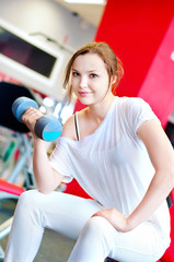 Woman doing splits with weights