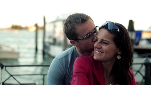 Couple in love hugging and kissing in Venice, steadycam shot