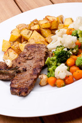 grilled steak and vegetables