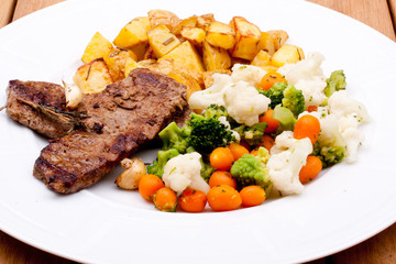 grilled steak and vegetables