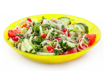 Fresh vegetable salad in yellow bowl