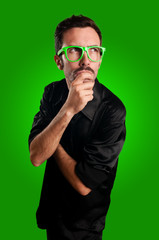 thoughtful man with green eyeglasses