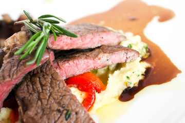 Sirloin beef steak with mashed potato and tomato