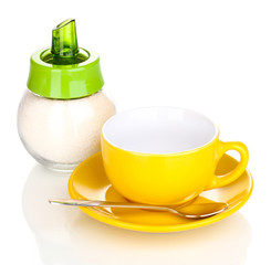 Yellow cup and saucer isolated on white