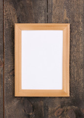 Wooden frame on wooden background