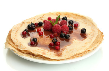 Delicious pancakes with berries and chocolate