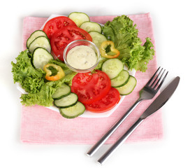 Chopped vegetables and sauce on plate isolated on white