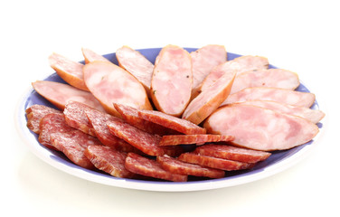 Tasty sliced sausage on plate isolated on white