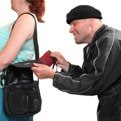 Thief stealing from handbag of a woman.