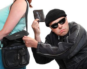 Thief stealing from handbag of a woman.