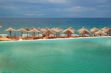 Swimming pool by a beach at the modern luxury hotel, Halkidiki,