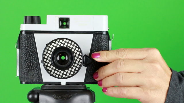 women hand releasing shutter 2 loop clips