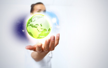 Human hand holding our planet earth