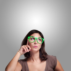 beautiful girl thinking with green eyeglasses
