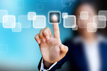 hand of business women pushing a button on a touch screen interf
