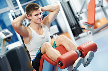 Fototapeta premium bodybuilding man at abdominal crunch exercises