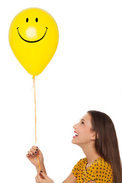 Woman With Smiley Face Balloon