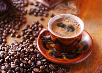 Coffee cup and  beans.