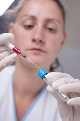 Injecting blood in test tube