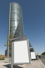 Madrid. Bus Stop Billboard in the City and Skycraper &copy; ddrash