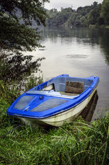 Abbandoned boat on Adda river color image