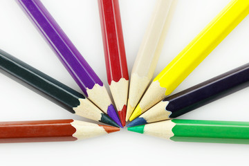 Row of colored pencils, on white background
