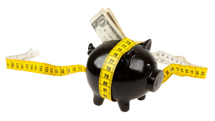 Black piggy bank with measuring tape