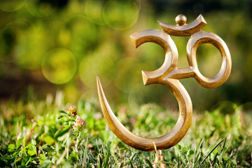 Om statue on the grass