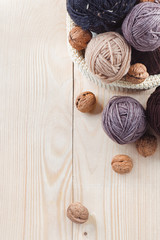 colorful balls of yarn on a wooden table