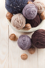 colorful balls of yarn on a wooden table