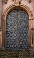 Cast iron doors with stone surround