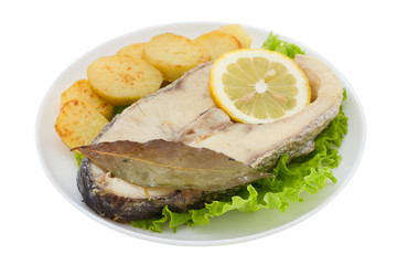 boiled perch on lettuce with fried potato