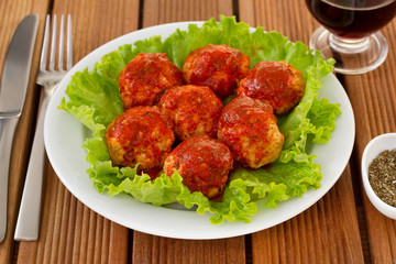 chicken meatballs with tomato sauce on  the plate