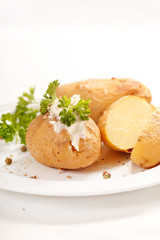 Baked potato filled with soft cheese