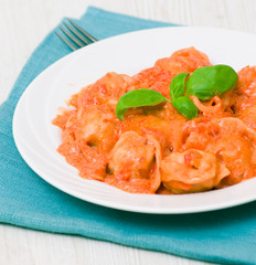 Ravioli in tomato-cream sauce