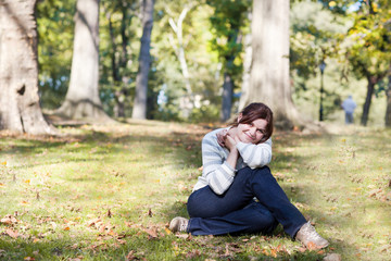 Young beautiful woman in park